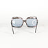 Lunettes Essel 70’s avec verres bleus sur fond blanc