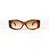 vue de face d’une paire de lunettes solaires vintage écaille avec verres dégradés bruns sur fond blanc