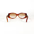 Vue frontale de lunettes de soleil vintage écaille avec monture épaisse et verres ovales