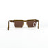 Vue en plongée des lunettes de soleil vintage Christian Lacroix 7318 avec branches repliées et monture en optyl brun translucide