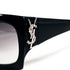 Détail logo YSL strassé sur branche de lunettes Yves Saint Laurent vintage noires