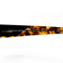 lunettes de soleil Mariella Burani repliées vues de dessus avec logo doré sur les branches