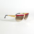 Détail monture Missoni M 187/S en métal doré et acétate rouge vue de profil