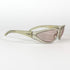Vue de profil d’une monture Moschino vintage beige translucide sur fond blanc