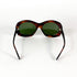 Lunettes de soleil vintage écaille marron verres verts pliées vue dessus