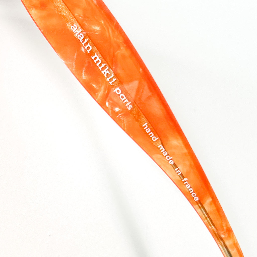 détail inscription alain mikli handmade france branche lunettes vintage orange
