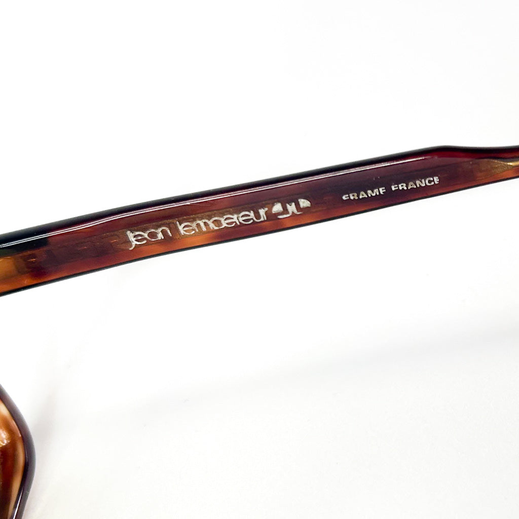 Lunettes de soleil Jean Lempereur vues de face, branches ouvertes, verres jaunes