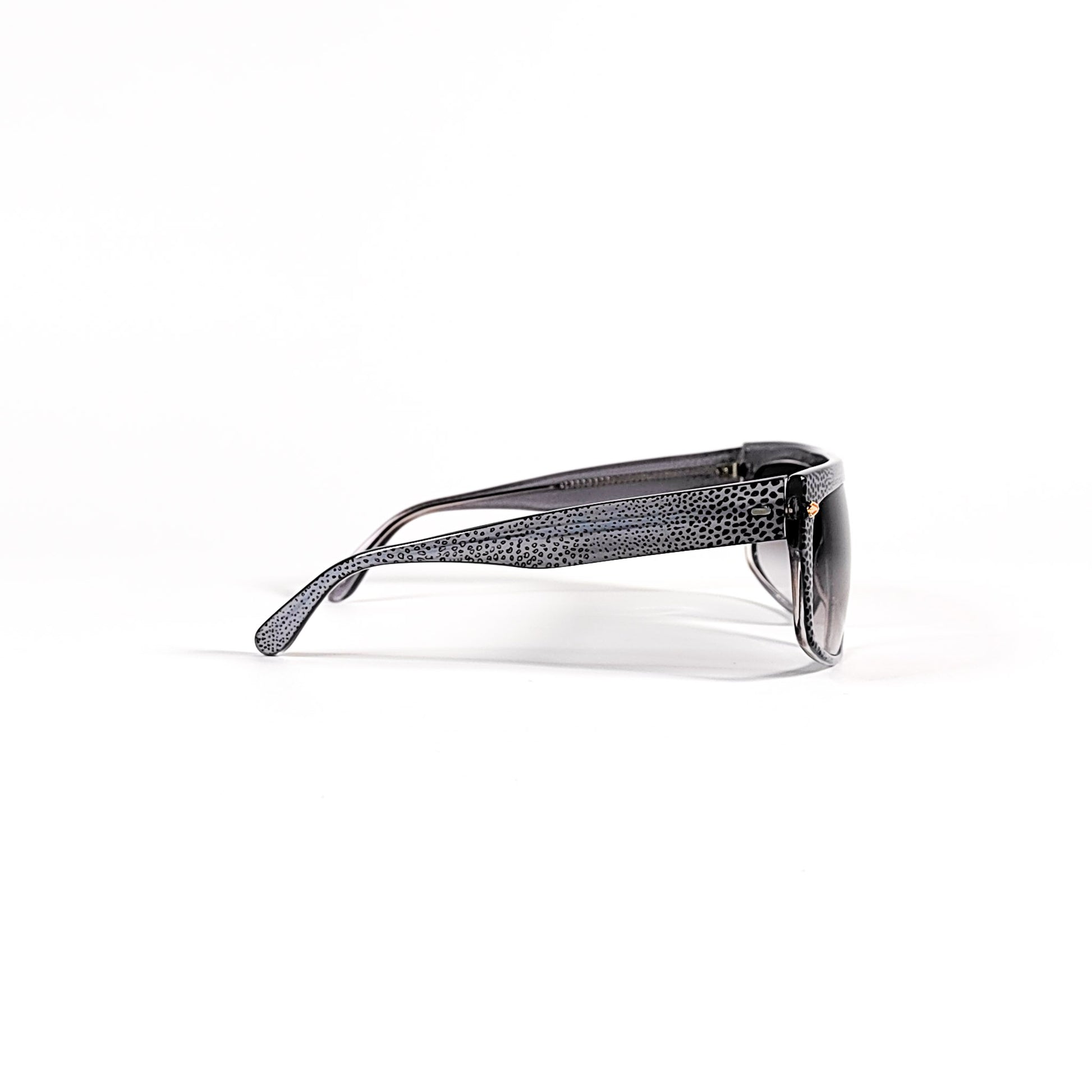 Lunettes Babil vintage profil droit, monture acétate granité, charnière dorée visible.