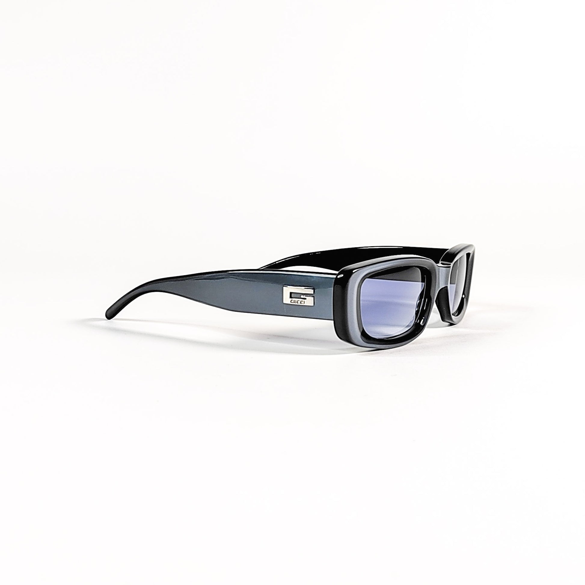 Gucci GG 2409/N/S, profil complet de la monture acétate noir Tom Ford era avec branche galbée.