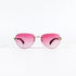 Lunettes de soleil vintage Porta Romana 1961 100R, vue de face, verres roses dégradés et pont métal doré