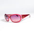 Lunettes Chanel 5022 vue en perspective, acétate rouge framboise translucide, double C doré sur la branche